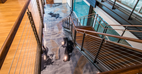 Poured-in-place floors can add sophistication to any office lobby or corridor, seamlessly blending style with a welcoming atmosphere.