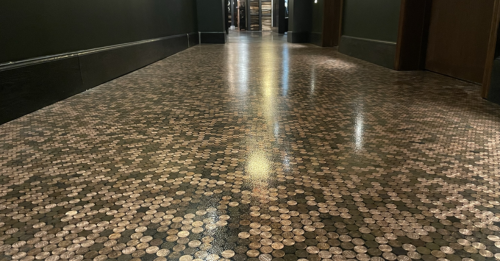 A floor that tells a story: Encapsulated pennies create a unique and eye-catching design for this restaurant.